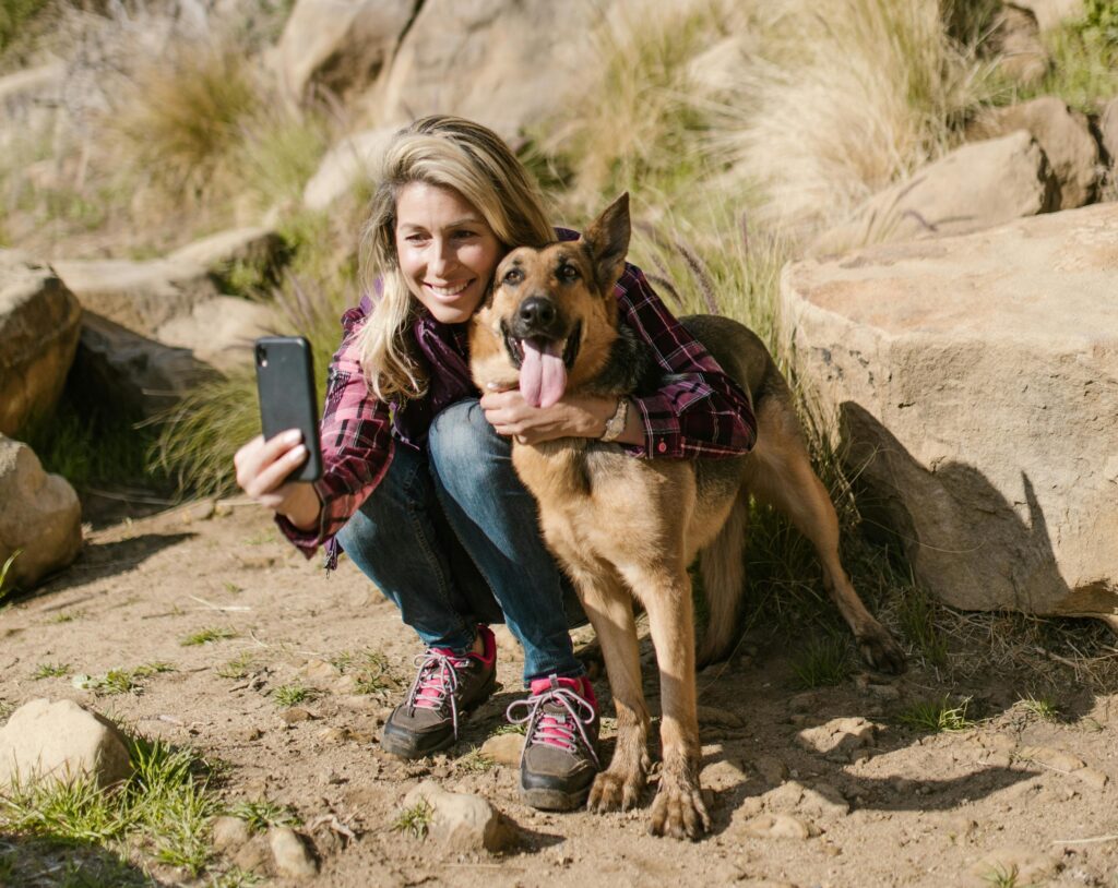 dog and woman taking selfie